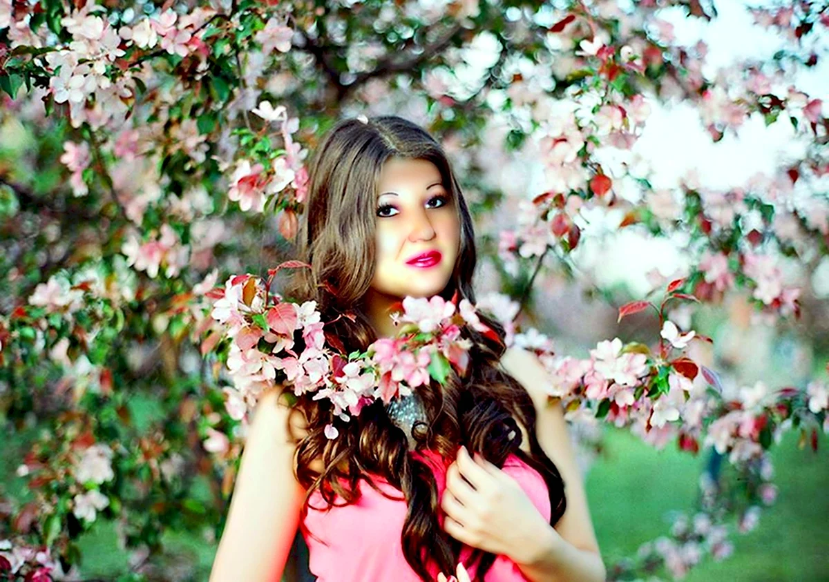 Девушка в цветущих яблонях